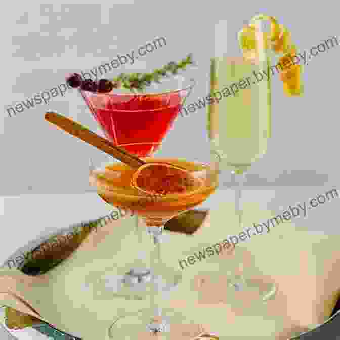 A Festive Cocktail, Garnished With Fruit And Herbs, Served In A Martini Glass Fix It And Forget It Christmas Cookbook: 600 Slow Cooker Holiday Recipes