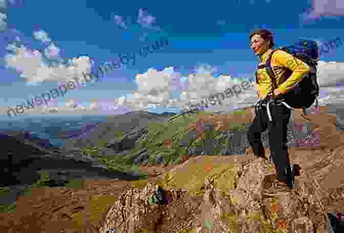 A Hiker Stands On A Mountaintop, Surrounded By A Panoramic View Of The Wilderness Stretching Out In Front Of Them. The Sky Is A Clear Blue, With Puffy White Clouds Drifting Overhead. The Hiker Is Wearing A Backpack And Hiking Poles, And They Are Looking Out Into The Distance With A Sense Of Awe And Wonder. At The Water S Edge: A Walk In The Wild