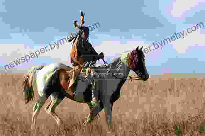 A Native American Man On Horseback Galloping Across A Field Native American Horsemanship (Native American Life)