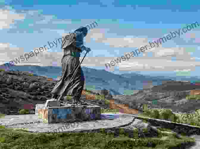 A Scenic View Of The Spanish Countryside Along The Camino De Santiago, With A Hiker Walking In The Foreground Camino Winds John Grisham