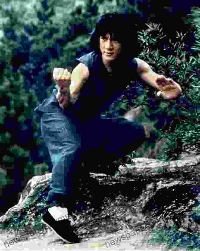 A Striking Image Of Jackie Chan In A Classic Martial Arts Pose, Surrounded By A Halo Of Light. Who Is Jackie Chan? (Who Was?)